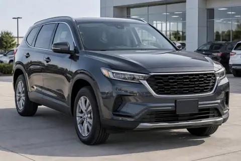 Mid-size SUV on a dealer lot, video frame at 0s