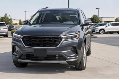 Mid-size SUV on a dealer lot, video frame at 5s